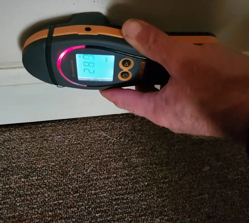 Moisture detection at baseboard during Storm Damage Restoration in Brigham City
